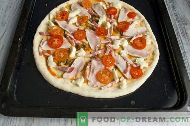Yeast pizza with ham and pancetta in the oven