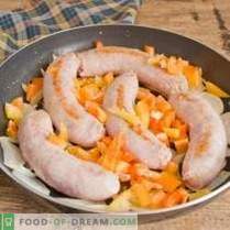 Fried sausage in a pan with country-style potatoes