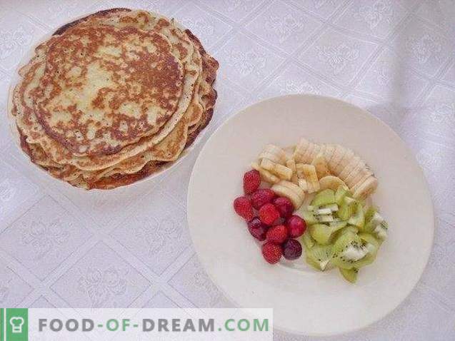 Custard pancakes on kefir with fruit and whipped cream