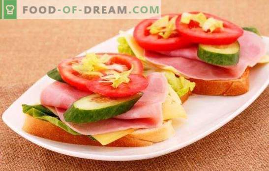 Sandwiches mit Wurst, Käse und Tomaten - einfach und elegant! Eine Auswahl köstlicher Sandwiches mit Wurst, Käse und Tomaten