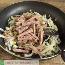 Warm salad with funchoza, beef and mushrooms